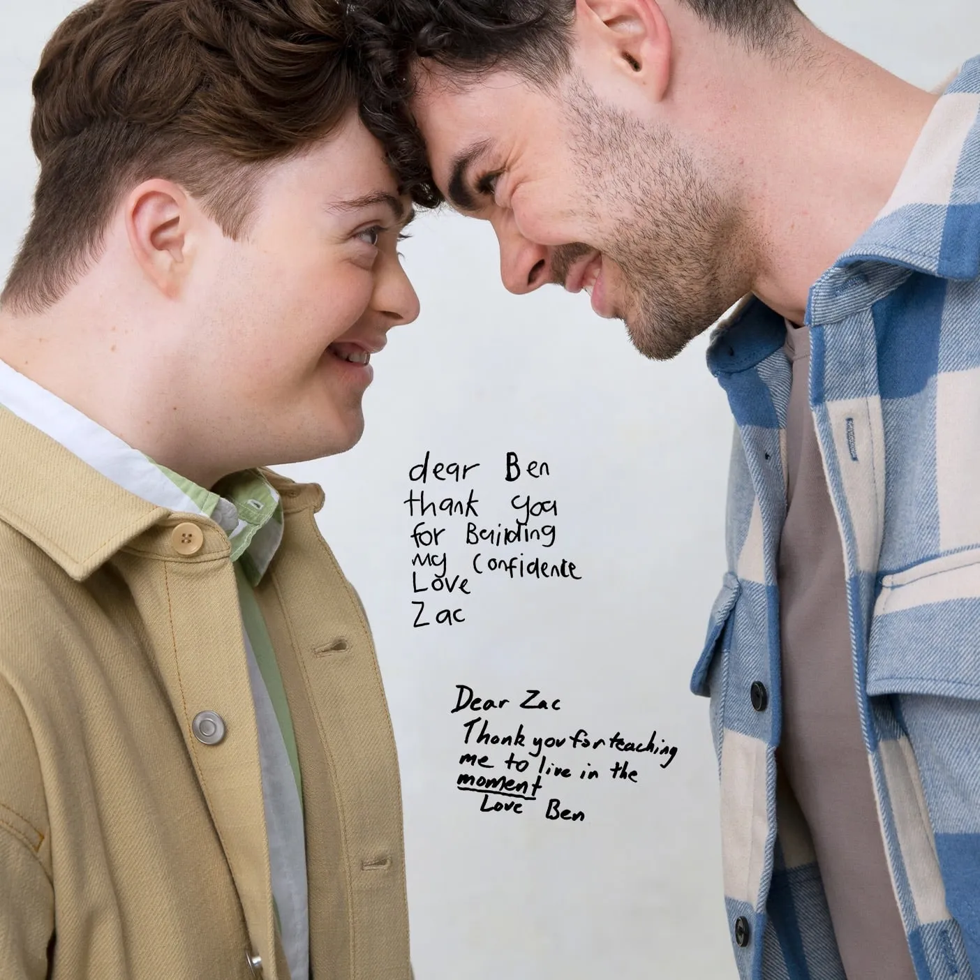 Ben and Zac smiling at each other