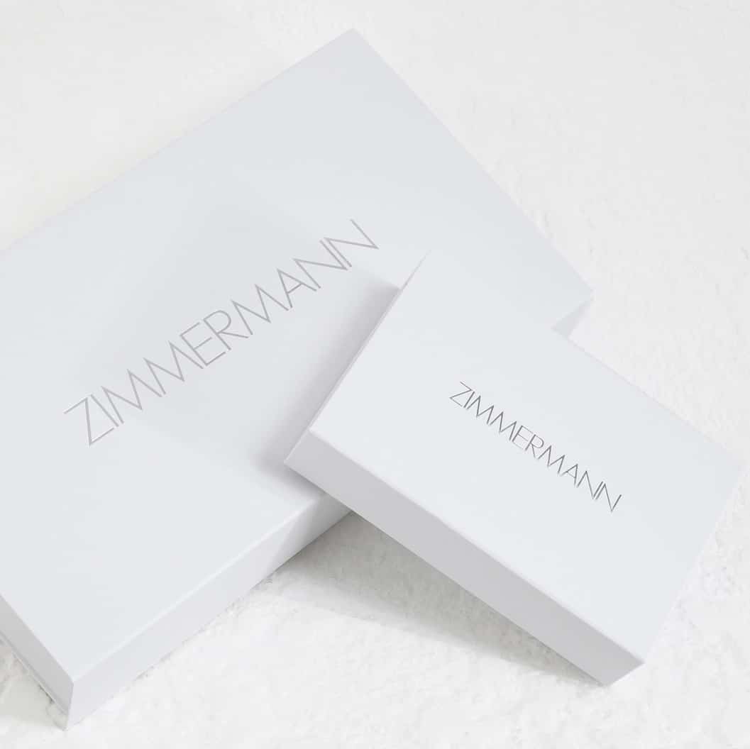 Two white boxes with silver Zimmermann branding